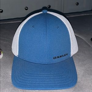 Blue and white Oakley hat with black logo
